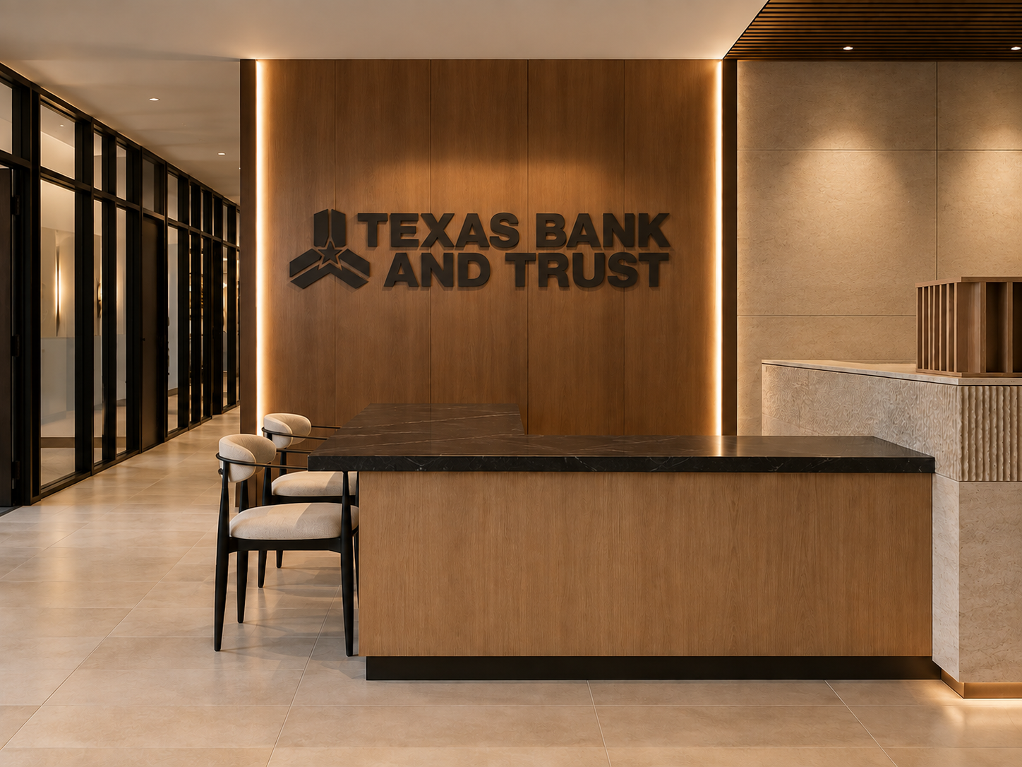 A contemporary Texas Bank and Trust reception area with wood paneling, stone surfaces and integrated lighting